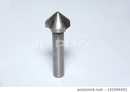 Sturdy metallic router bit for wood carving, sharp focus on cutting edge, white background Sturdy metallic router bit for wood carving, sharp focus on cutting edge, white background 142994483