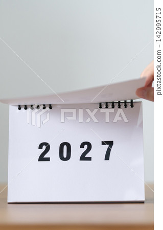 2026 to 2027 New Year Concept. Hand Turning Calendar Page Representing New Beginning, Year Transition, Future Planning, Change, Growth, Goal Setting and Fresh Start 2026 to 2027 New Year Concept. Hand Turning Calendar Page Representing New Beginning, Year Transition, Future Planning, Change, Growth, Goal Setting and Fresh Start 142995715