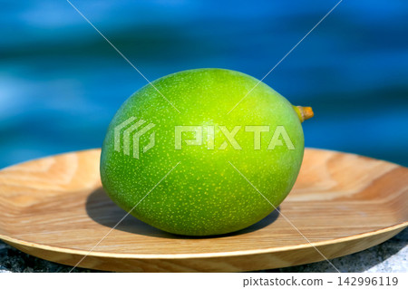 Rare, perfectly ripe Keitt mangoes, a specialty of Okinawa. Rare, perfectly ripe Keitt mangoes, a specialty of Okinawa. 142996119