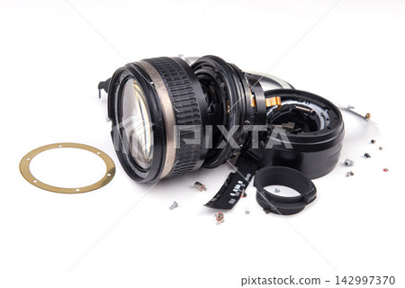 Disassembled Camera Lens Parts on White Background Disassembled Camera Lens Parts on White Background 142997370