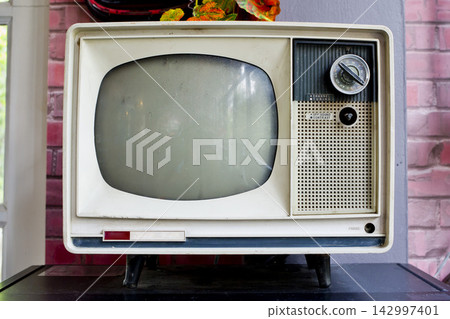 Vintage Television Set with Retro Analog Screen and Control Knobs Vintage Television Set with Retro Analog Screen and Control Knobs 142997401