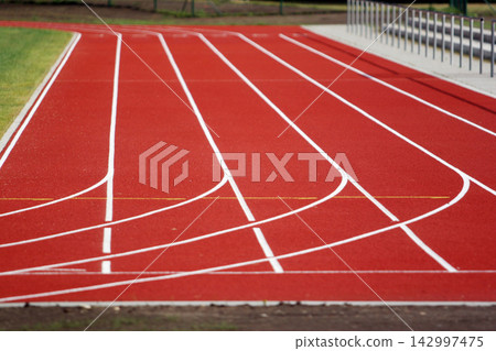 Red Running Track Lanes at Outdoor Athletics Stadium 142997475
