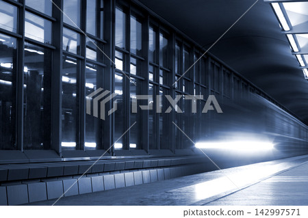 Modern Train Station Platform with Motion Blur Light Trails Modern Train Station Platform with Motion Blur Light Trails 142997571