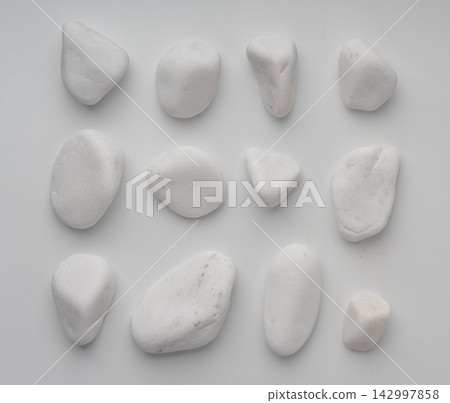 White marble pebble, decorative garden stone isolated White marble pebble, decorative garden stone isolated 142997858