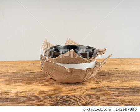 Eco paper packaging texture background, crumpled biodegradable cardboard packing 142997990
