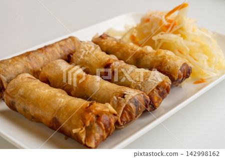 Fried Chinese spring roll on restaurant plate Fried Chinese spring roll on restaurant plate 142998162