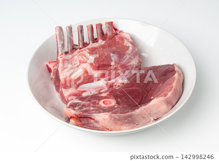 Raw lamb rack isolated, fresh mutton fillet with ribs, tenderloin pieces, mutton rump sirloin meat Raw lamb rack isolated, fresh mutton fillet with ribs, tenderloin pieces, mutton rump sirloin meat 142998246