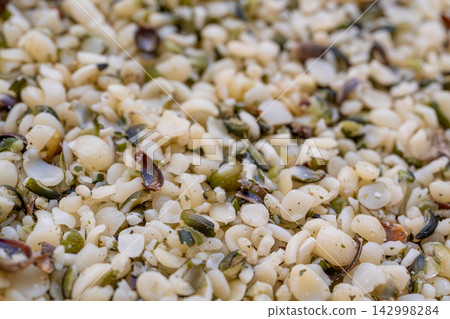 Shelled hemp seeds texture background Shelled hemp seeds texture background 142998284