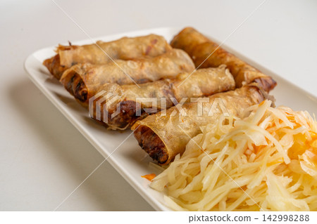Fried Chinese spring roll on restaurant plate Fried Chinese spring roll on restaurant plate 142998288
