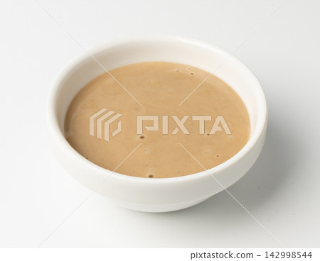 Tahini, sesame seeds paste, tahina sauce, eastern dip, traditional oriental ground sesame Tahini, sesame seeds paste, tahina sauce, eastern dip, traditional oriental ground sesame 142998544