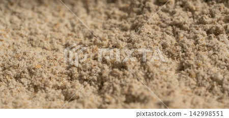 Wheat flour powder textured background, spelt grain dust pattern Wheat flour powder textured background, spelt grain dust pattern 142998551