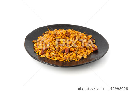 Navrattan namkeen mixture. Indian nimko snack, spicy and sweet farsaan Navrattan namkeen mixture. Indian nimko snack, spicy and sweet farsaan 142998608