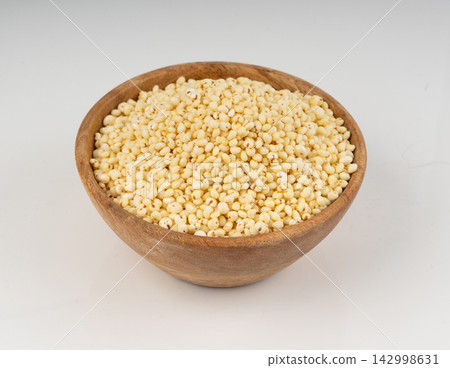 Puffed millet isolated, crispy cereal breakfast, ancient healthy food Puffed millet isolated, crispy cereal breakfast, ancient healthy food 142998631