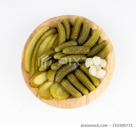 Pickled sliced cucumbers, fermented food, marinated canned vegetables, gherkins, pickles Pickled sliced cucumbers, fermented food, marinated canned vegetables, gherkins, pickles 142998735