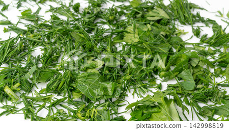 Fresh chopped herbs textured background Fresh chopped herbs textured background 142998819