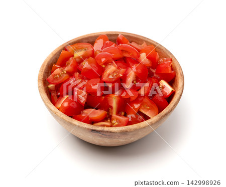 Tomato halves on plate isolated, cherry tomatoes pieces Tomato halves on plate isolated, cherry tomatoes pieces 142998926