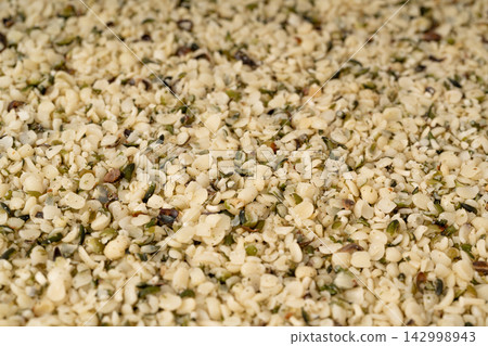 Shelled hemp seeds texture background Shelled hemp seeds texture background 142998943