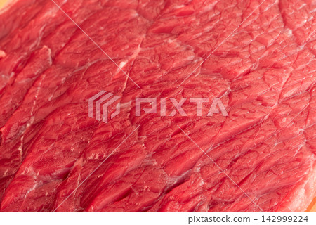 Raw beef steak macro pattern, red meat slice closeup 142999224