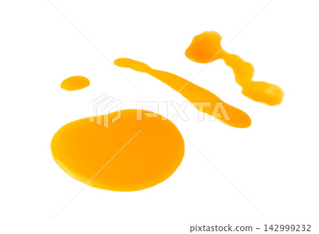 Spilled orange juice isolated, mango smoothie puddle, liquid stain, carrot juice splatter Spilled orange juice isolated, mango smoothie puddle, liquid stain, carrot juice splatter 142999232