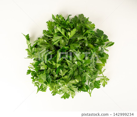 Fresh parsley leaf with water drops isolated Fresh parsley leaf with water drops isolated 142999234