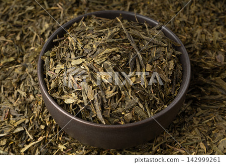 Green tea leaves macro textured background Green tea leaves macro textured background 142999261
