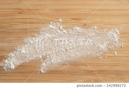 Wheat flour powder textured background, spelt grain dust pattern Wheat flour powder textured background, spelt grain dust pattern 142999272
