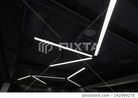 Modern LED ceiling lights form angular geometric patterns Modern LED ceiling lights form angular geometric patterns 142999278