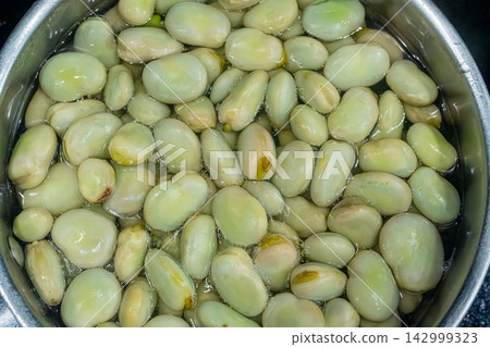 Broad beans or fava beans closeup 142999323
