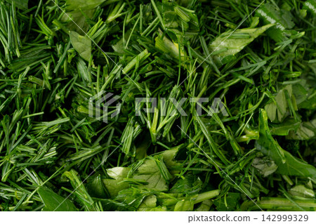 Fresh chopped herbs textured background Fresh chopped herbs textured background 142999329
