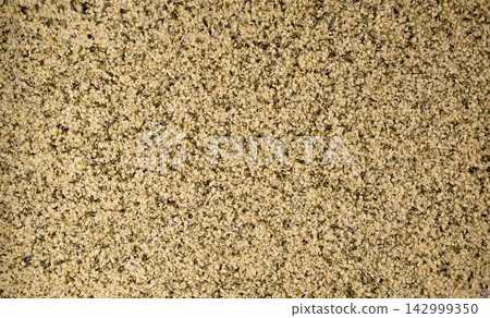 Shelled hemp seeds texture background Shelled hemp seeds texture background 142999350