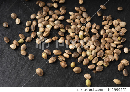 Hemp seeds pile texture background Hemp seeds pile texture background 142999351