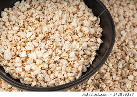 Puffed buckwheat textured background Puffed buckwheat textured background 142999387