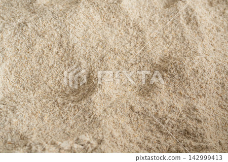 Wheat flour powder textured background, spelt grain dust pattern Wheat flour powder textured background, spelt grain dust pattern 142999413
