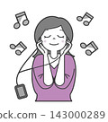 Woman listening to music 1 143000289