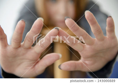 A beautiful Japanese woman leaning back in a chair, looking relaxed. A beautiful Japanese woman leaning back in a chair, looking relaxed. 143000889