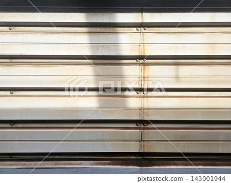 Weathered corrugated metal train wall paneling with rust and industrial texture Weathered corrugated metal train wall paneling with rust and industrial texture 143001944