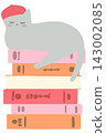 A cat wearing a beret relaxes on top of a stack of books. 143002085