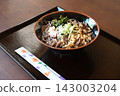 Warm soba noodles topped with seaweed, tempura flakes, and green onions. 143003204