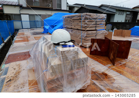 Unloading Building Materials at Construction Site Unloading Building Materials at Construction Site 143003285