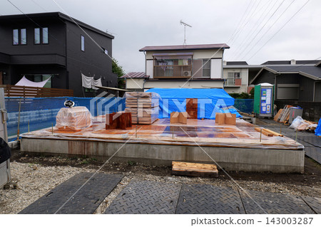 Unloading Building Materials at Construction Site Unloading Building Materials at Construction Site 143003287
