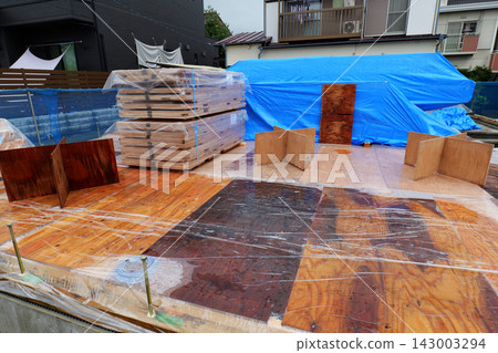 Unloading Building Materials at Construction Site Unloading Building Materials at Construction Site 143003294