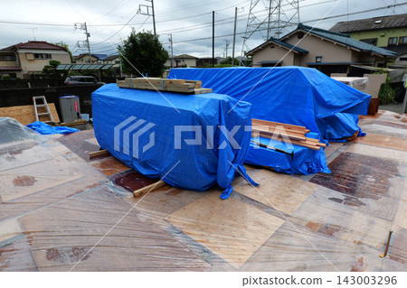 Unloading Building Materials at Construction Site Unloading Building Materials at Construction Site 143003296
