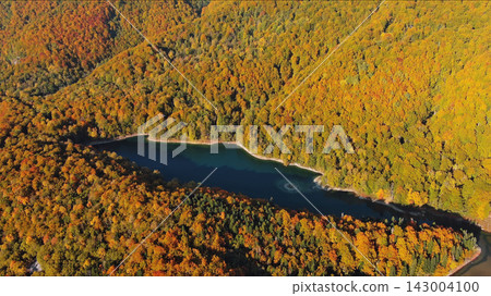 Biogradsko lake surrounded by mountains covered with bright autumn trees Biogradsko lake surrounded by mountains covered with bright autumn trees 143004100