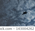 An airplane flying in the sky 143004262