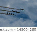 A parade under a blue sky 143004265