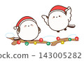 Two long-tailed tits wearing Santa hats spend time on a Christmas branch. 143005282