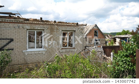 View to destroyed residential buildings at Kharkivska oblast. Ruined houses after bomb attacks on ukrainian territory from russia army. Consequences of russian invasion of Ukraine. Slow motion View to destroyed residential buildings at Kharkivska oblast. Ruined houses after bomb attacks on ukrainian territory from russia army. Consequences of russian invasion of Ukraine. Slow motion 143007742