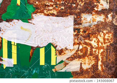 Rusty Metal with Torn Sticker Texture. Heavily corroded metal surface covered with torn paper, peeling stickers, remnants of paint. Layered rus, industrial distressed abstract background, copy space Rusty Metal with Torn Sticker Texture. Heavily corroded metal surface covered with torn paper, peeling stickers, remnants of paint. Layered rus, industrial distressed abstract background, copy space 143008067