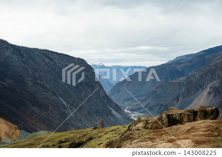 Majestic Mountain Valley Landscape Displayed Beautifully Under an Overcast Sky Above Majestic Mountain Valley Landscape Displayed Beautifully Under an Overcast Sky Above 143008225
