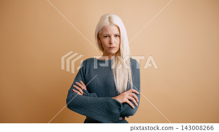 Woman with serious expression and determined attitude Woman with serious expression and determined attitude 143008266